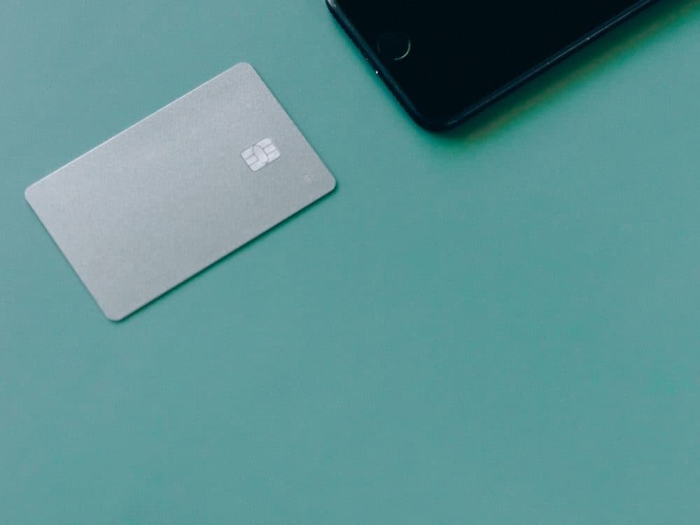 Bank card and phone ready for a withdrawal